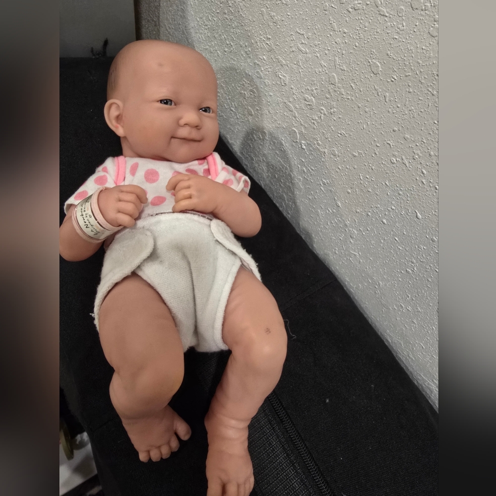 Adorable Baby Doll with Pink Polka Dot Outfit